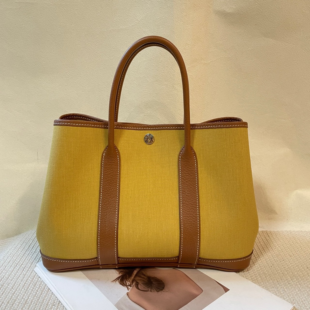 Bolso de mano Garden Party 30 de Hermes/Herms en lona, marrón combinado con amarillo jengibre, grabado Z